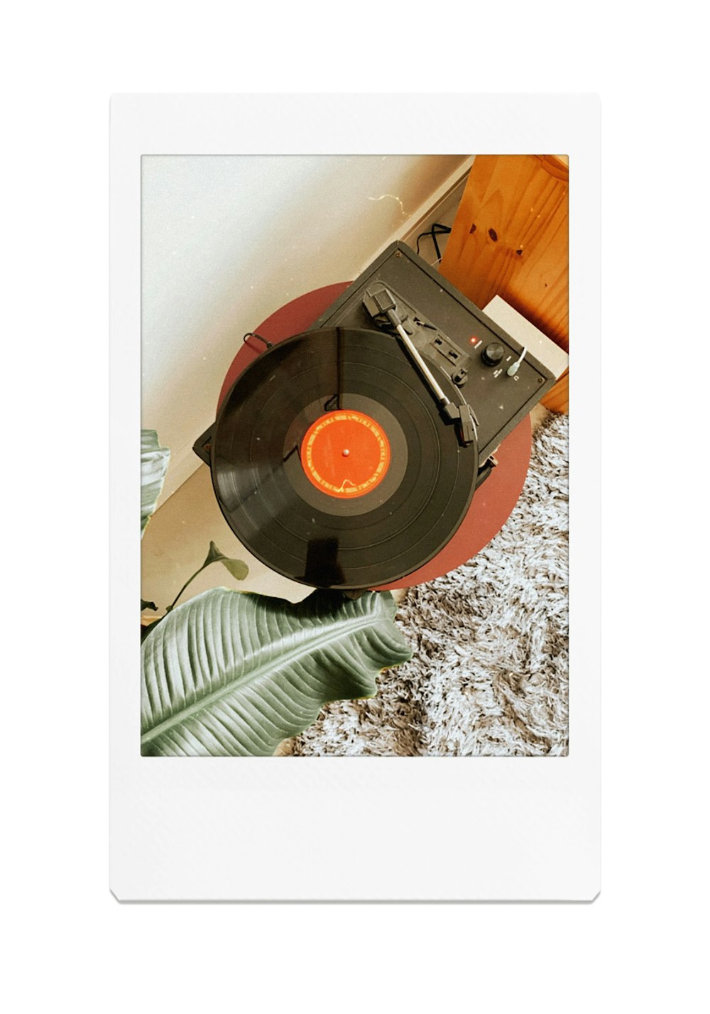 black vinyl record on white and black marble table