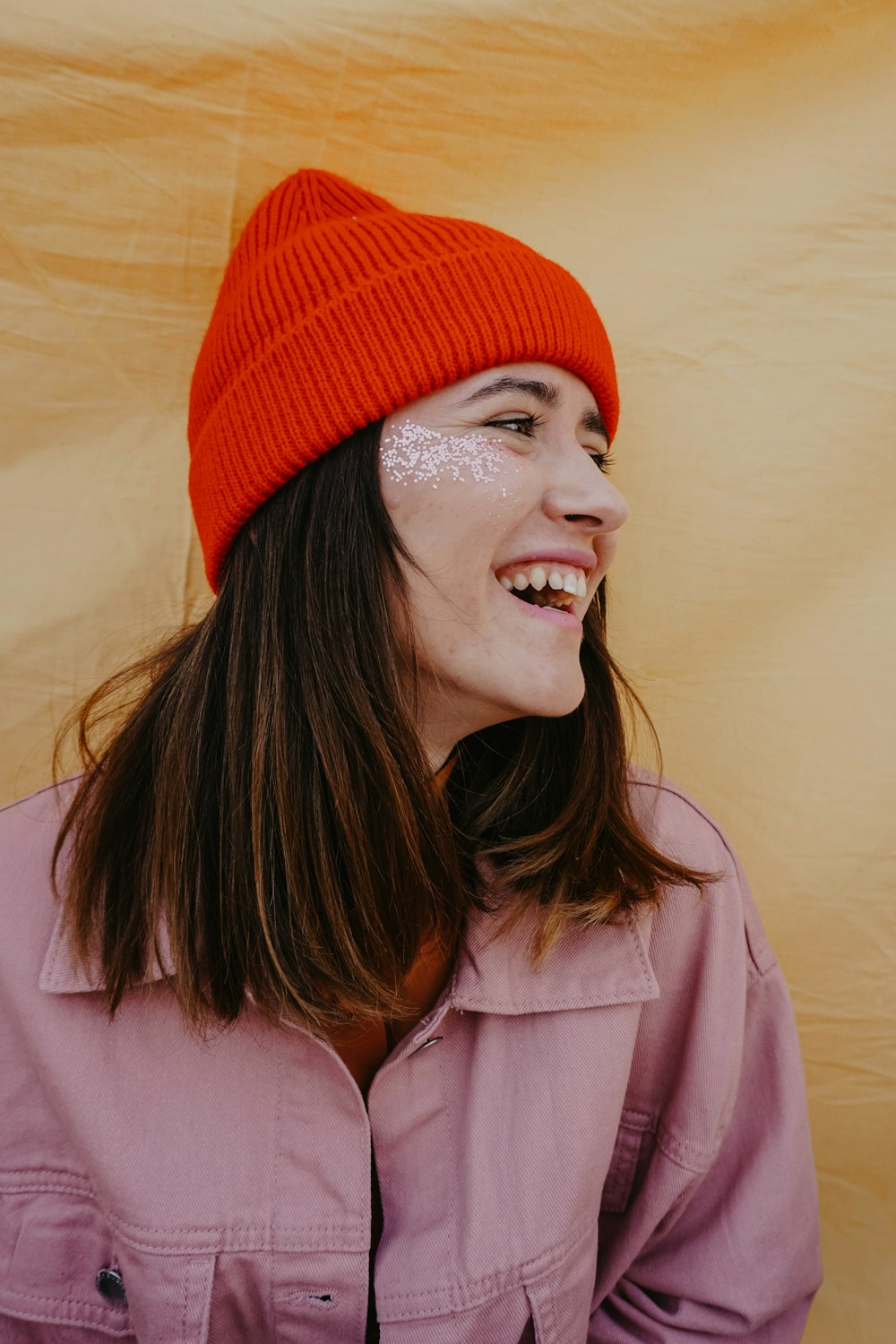 a woman wearing a red hat and smiling