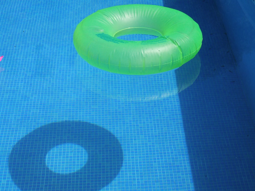 yellow inflatable ring on blue textile