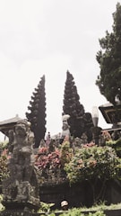 An ancient temple surrounded by lush greenery.