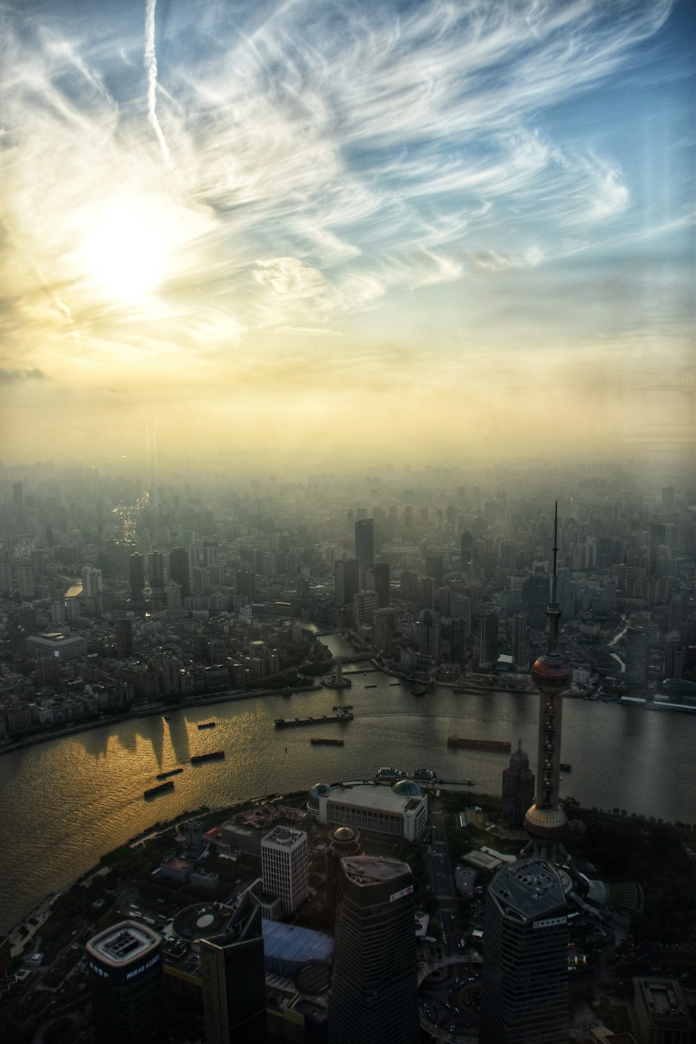 city skyline under white clouds during daytime