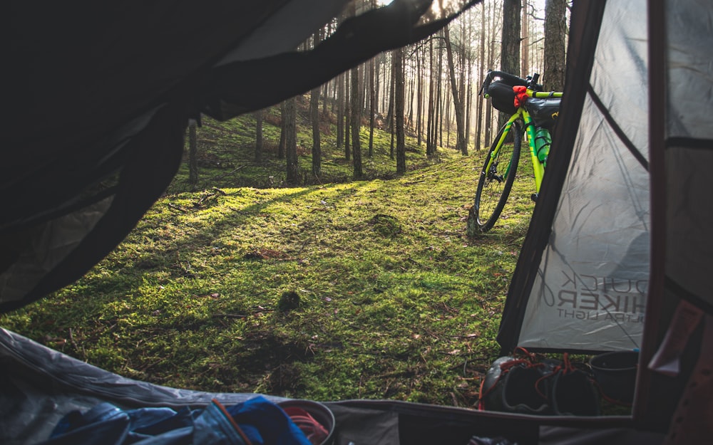 black mountain bike on green grass field