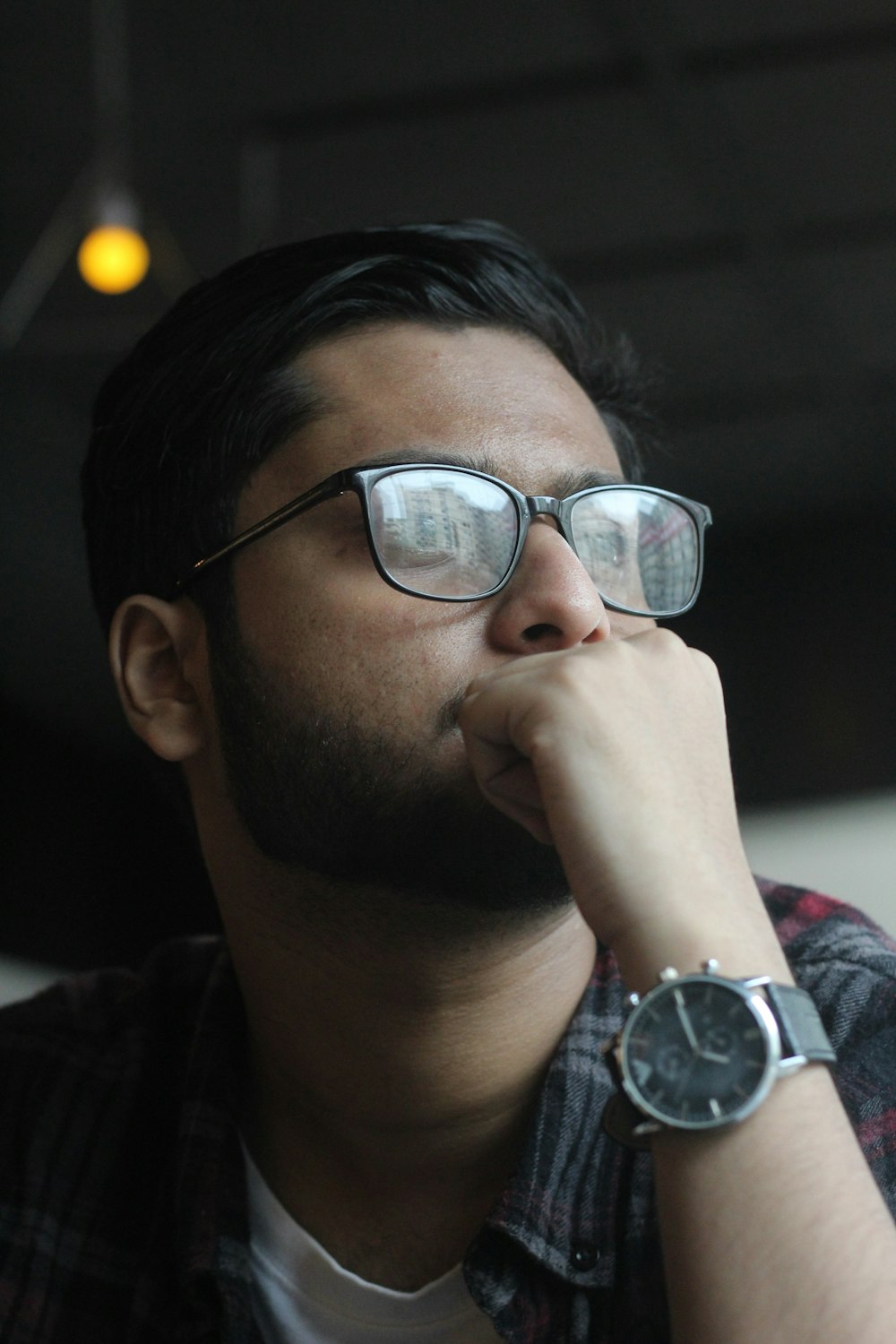 man in black framed eyeglasses