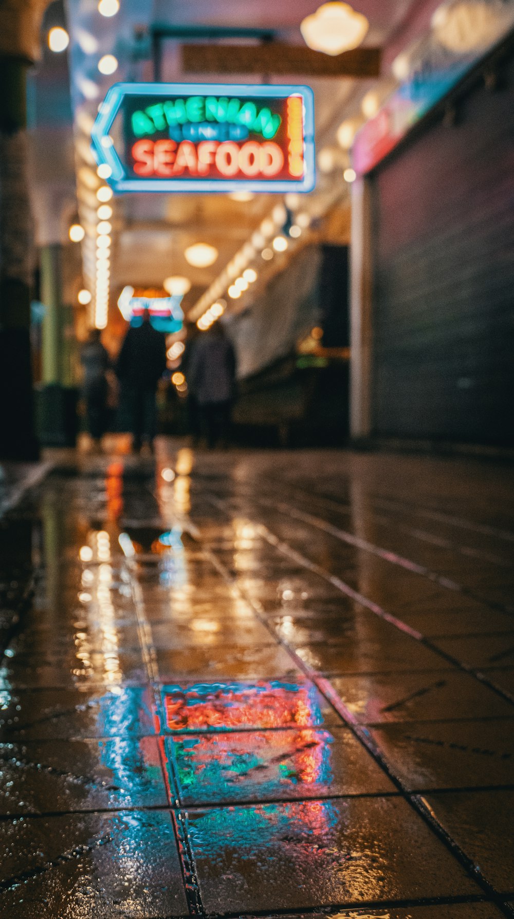 people walking on street during night time