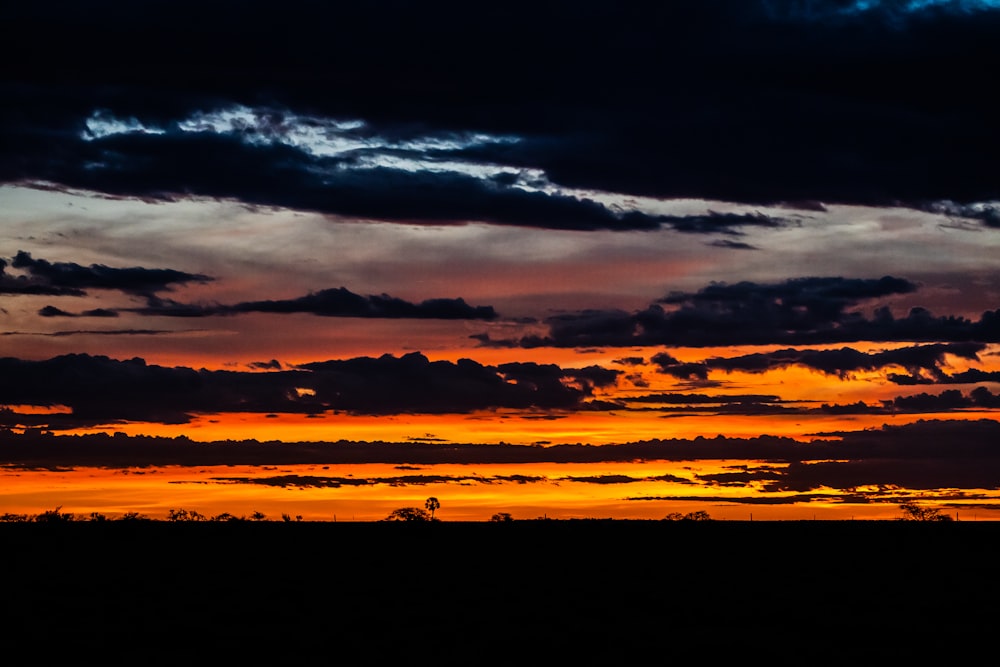 silhouette of clouds during sunset