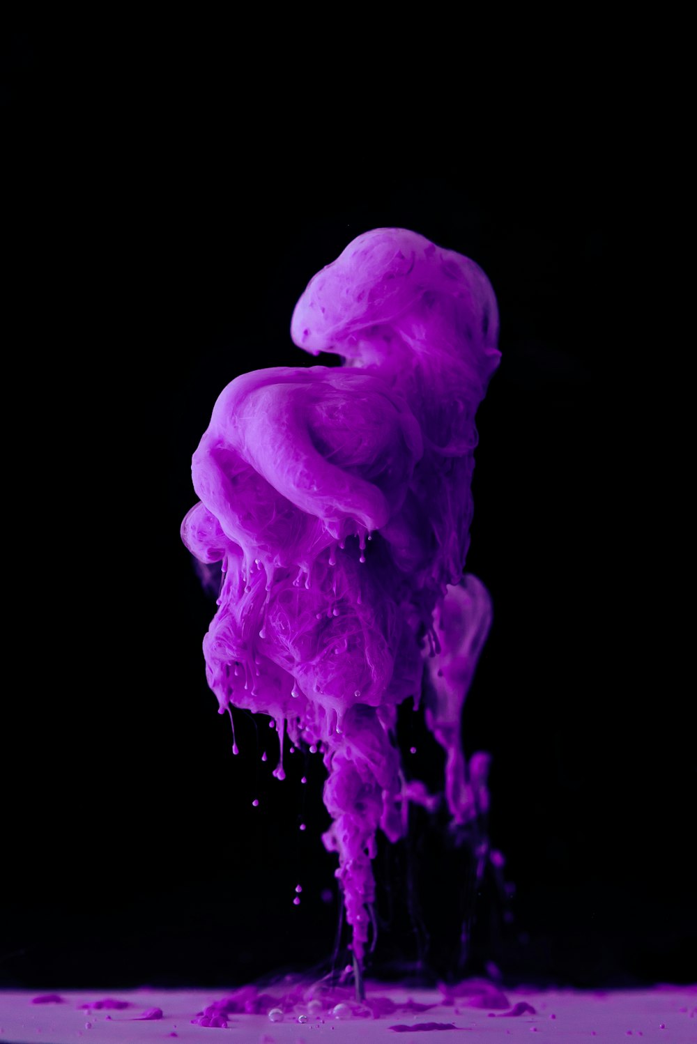 purple smoke on black background