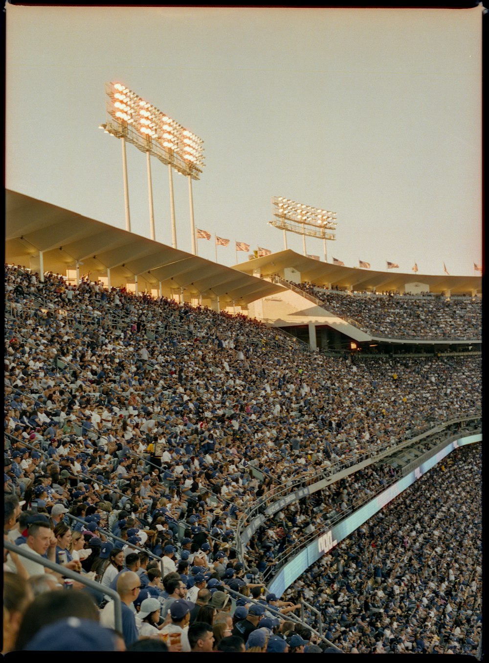 people sitting on stadium chairs during daytime