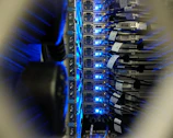 Close-up of a neatly organized data center rack with cables and servers glowing softly.