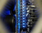 Server racks in a data center with blinking lights indicating active hosting services.