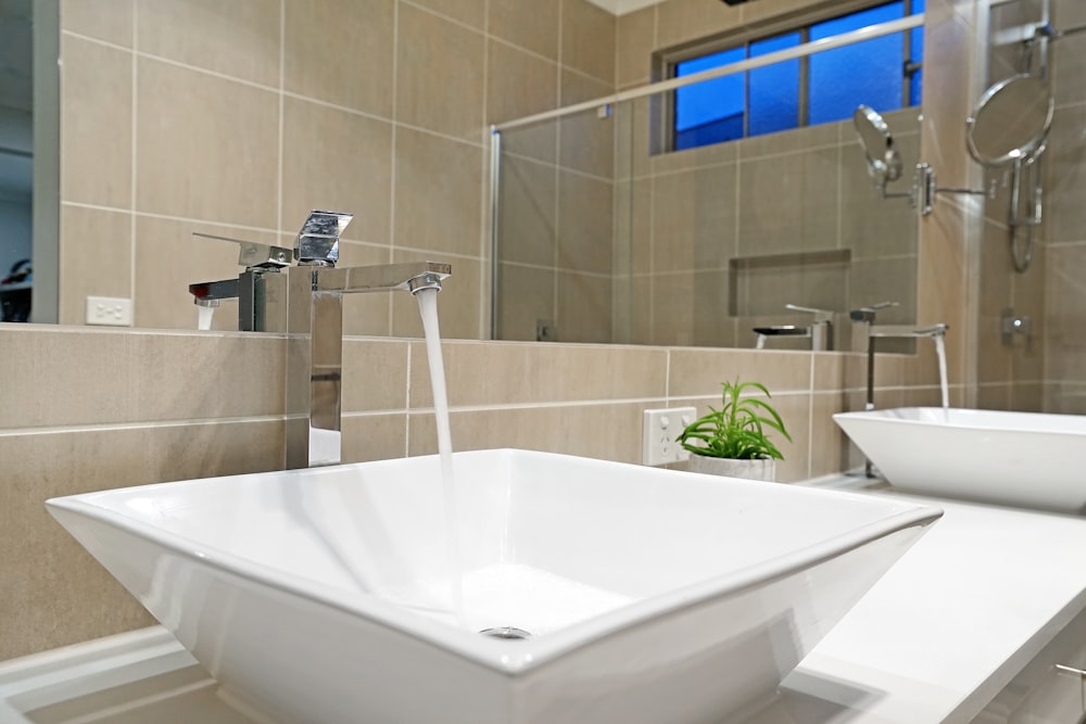 white ceramic sink with faucet