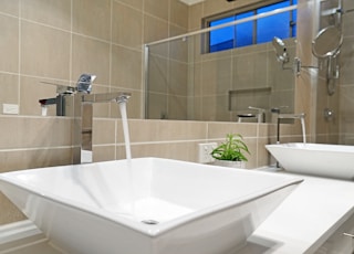 white ceramic sink with faucet