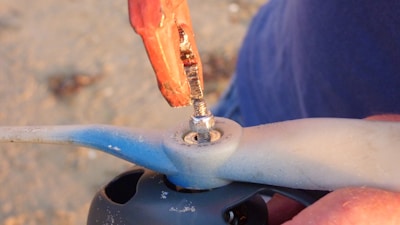 Close-up of a heavy-duty wrench gripping a bolt during repair work.