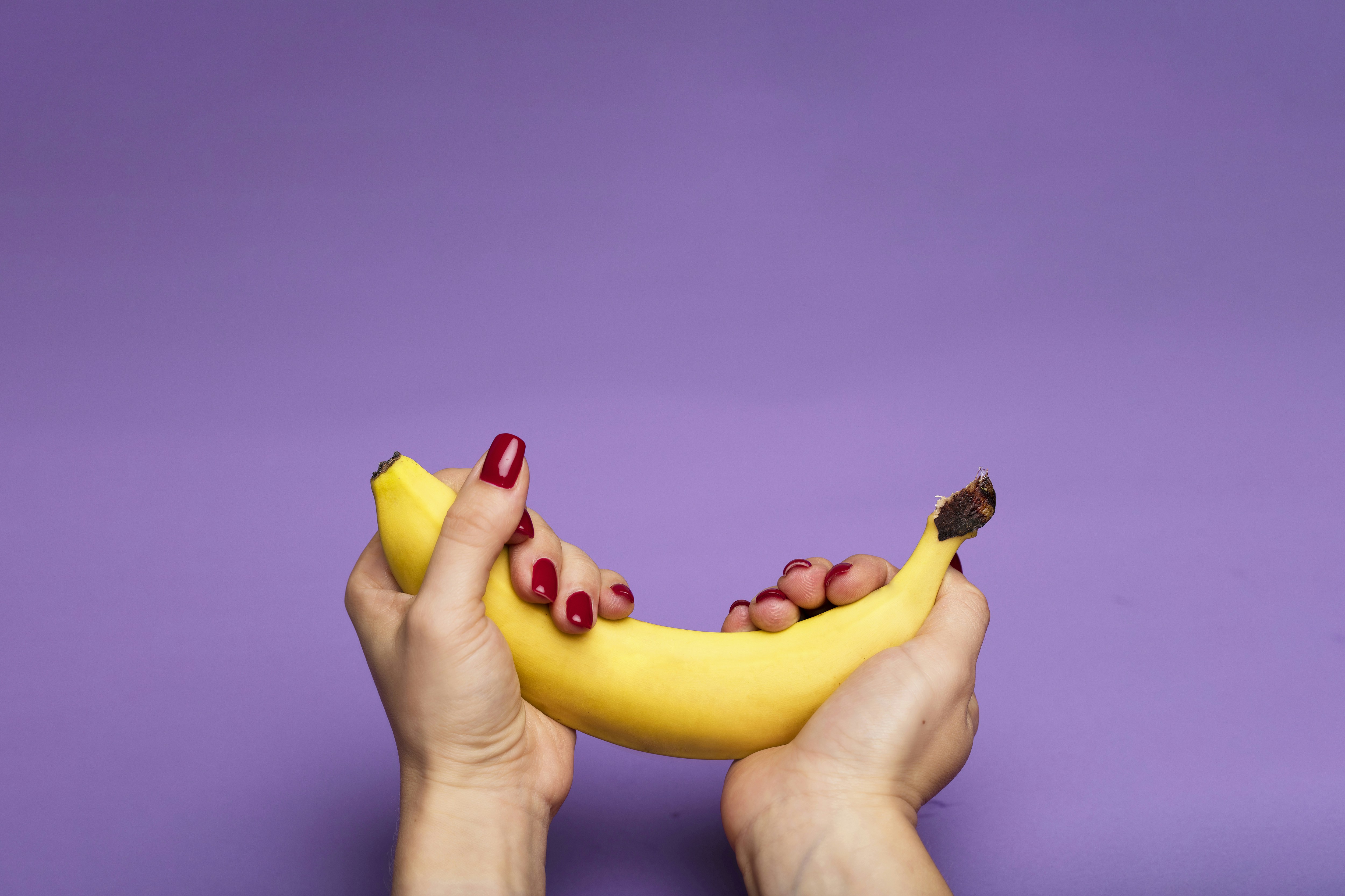 hands holding banana