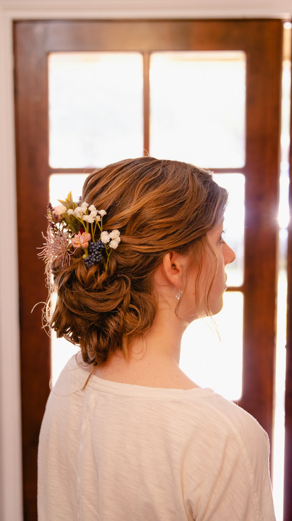 woman in white floral dress wearing white flower headband