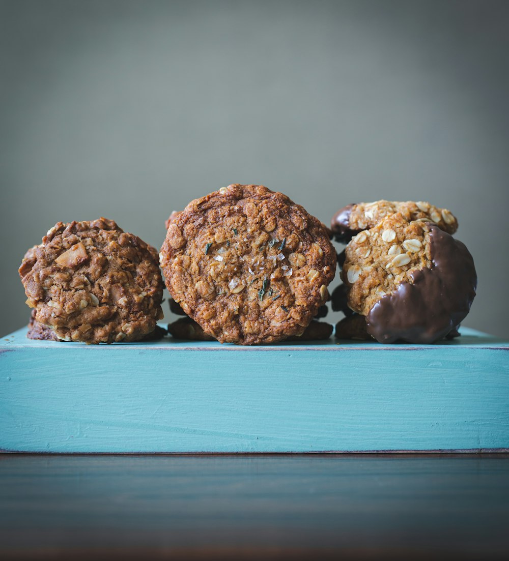 brown cookies on blue wooden table
