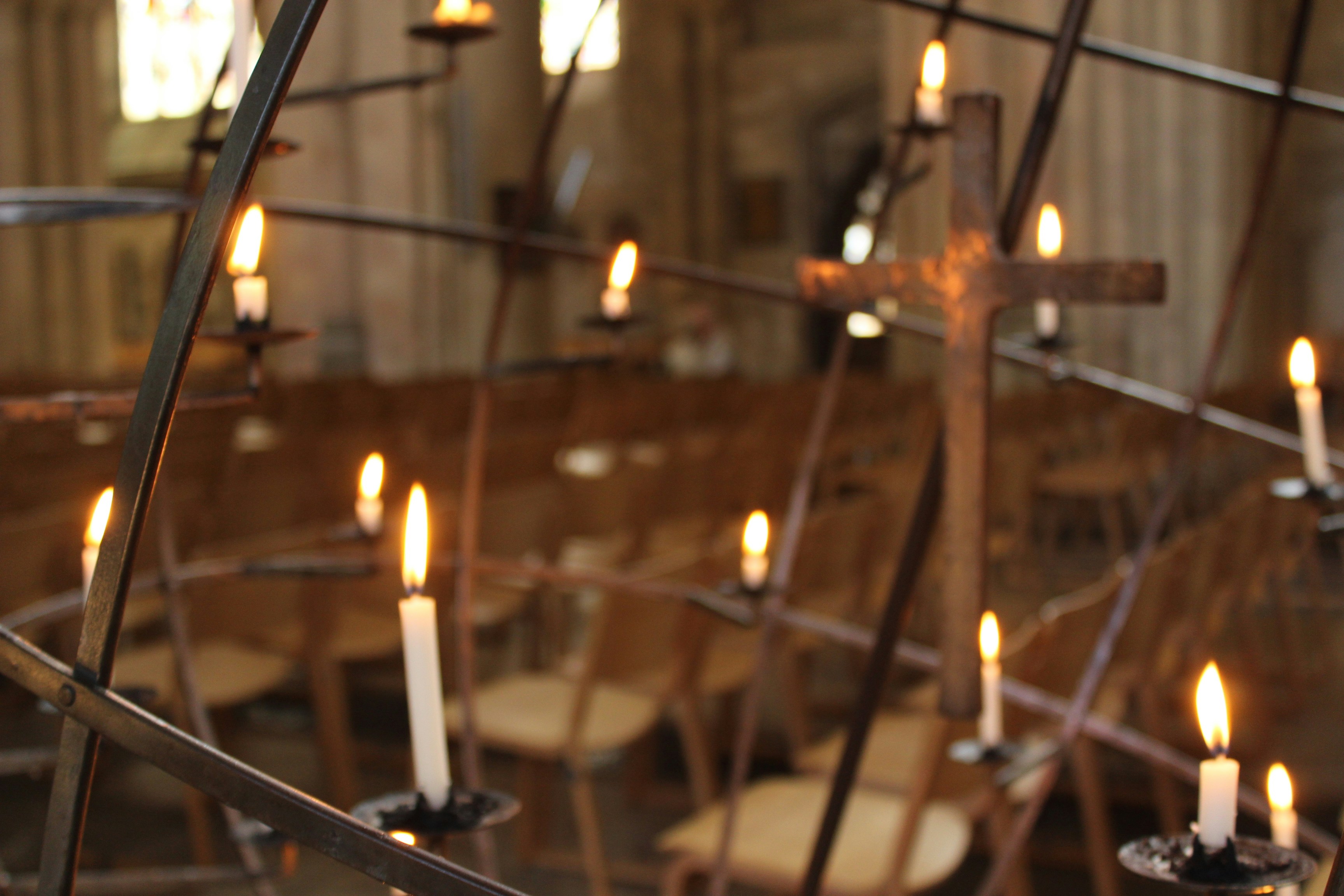 Candles glowing warmly in a church setting