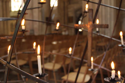 Peaceful evening church setting with candles lit for reflection and reconciliation.
