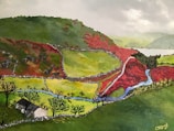 A vibrant landscape painting depicts rolling hills with patches of red and green vegetation separated by winding stone walls. A small stream meanders through the valley, with leafless trees scattered across the terrain. In the foreground, a small farmhouse is nestled among the greenery. The sky is overcast, casting a subdued light over the scene.