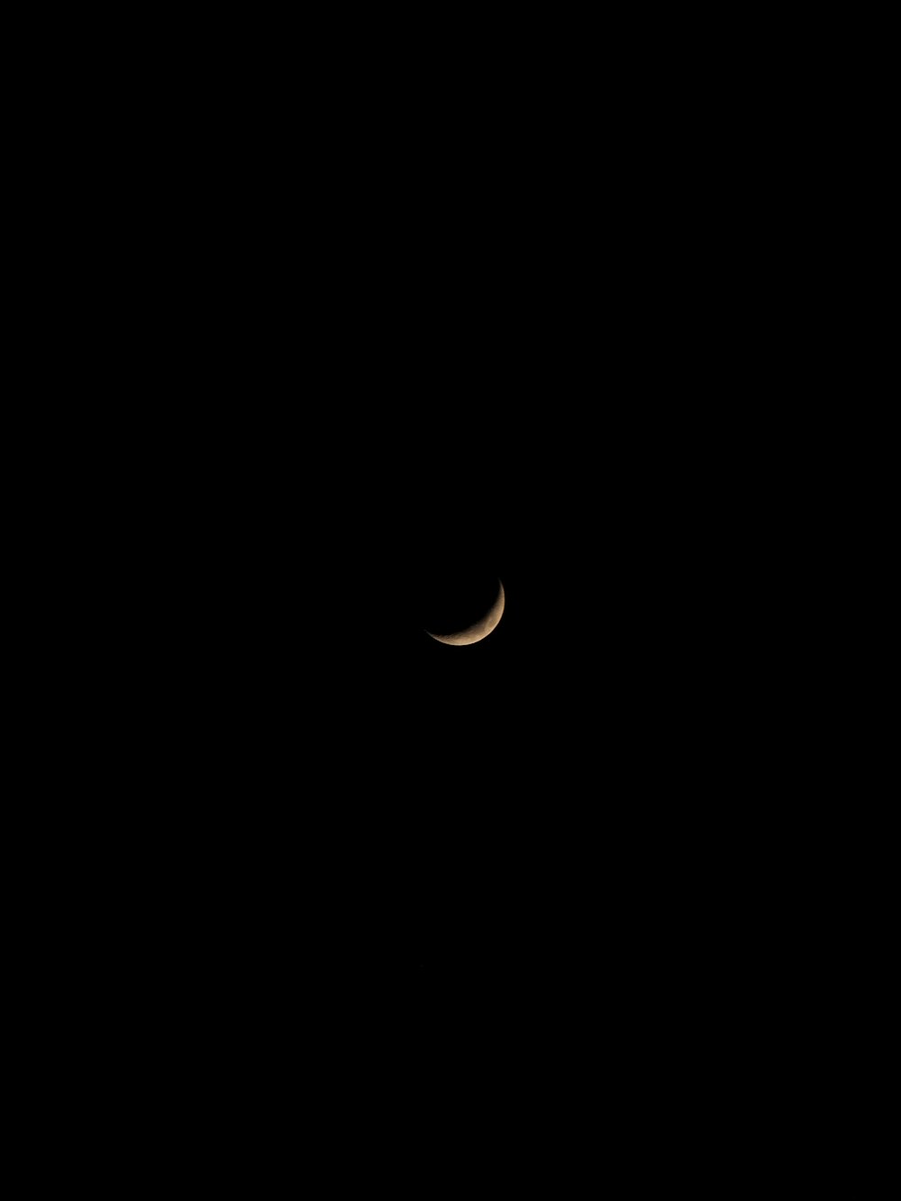 white crescent moon in black background