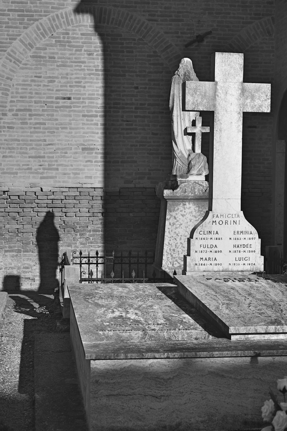 grayscale photo of concrete statue