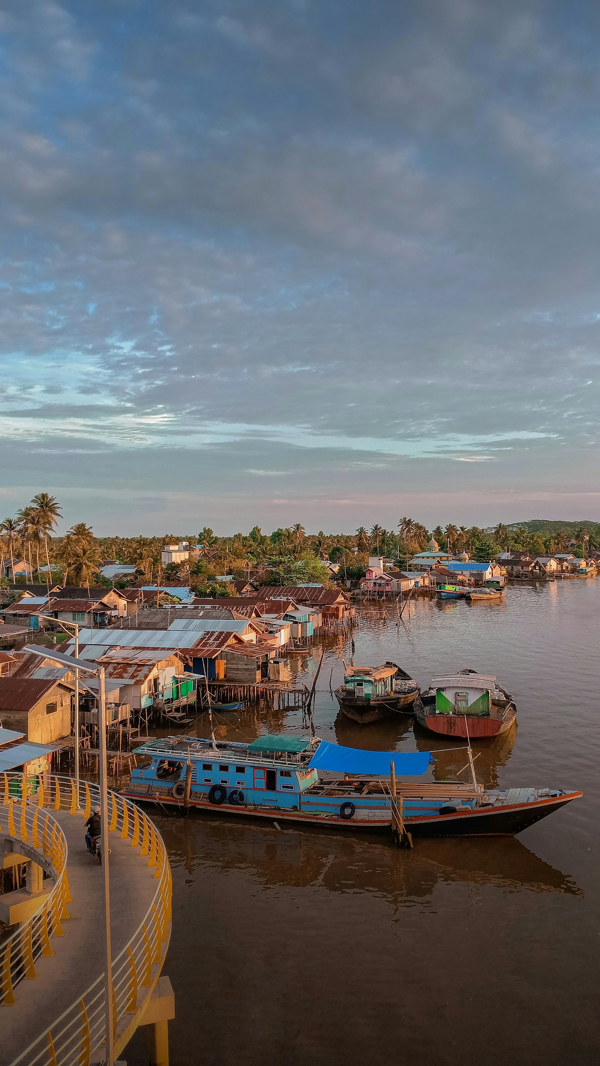 woman wearing yellow long-sleeved dress under white clouds and blue sky during daytime