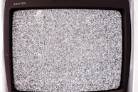 Close-up of a TV screen being tested after repair