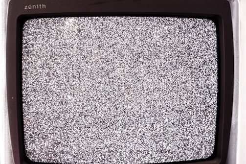 A technician diagnosing a flat-screen television.