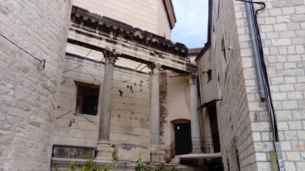 an old building with a staircase going up to it