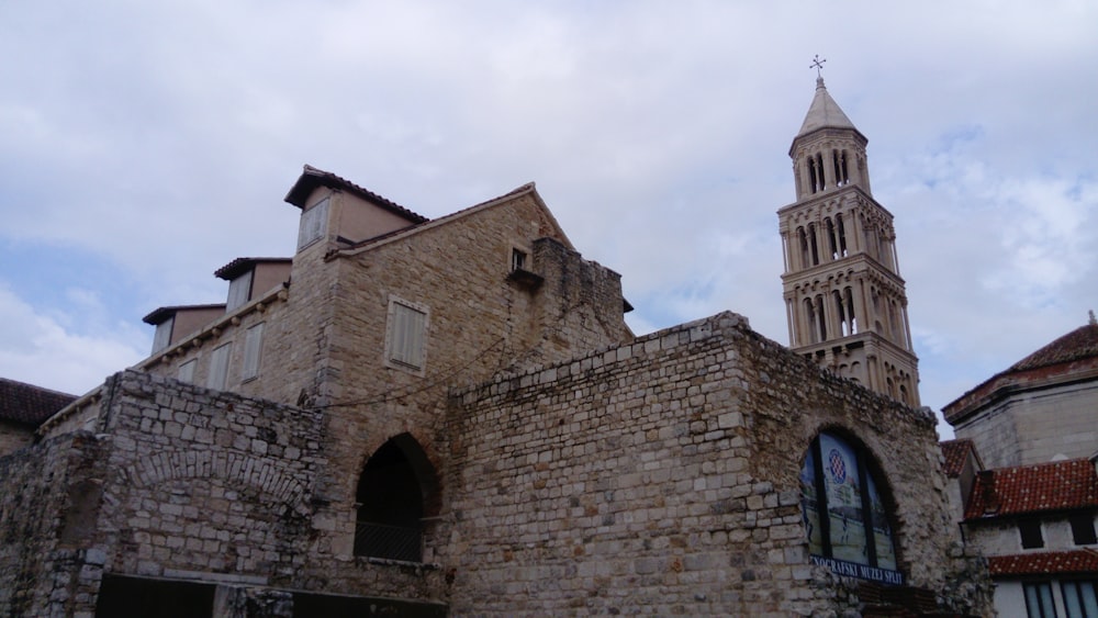 an old building with a clock tower in the background