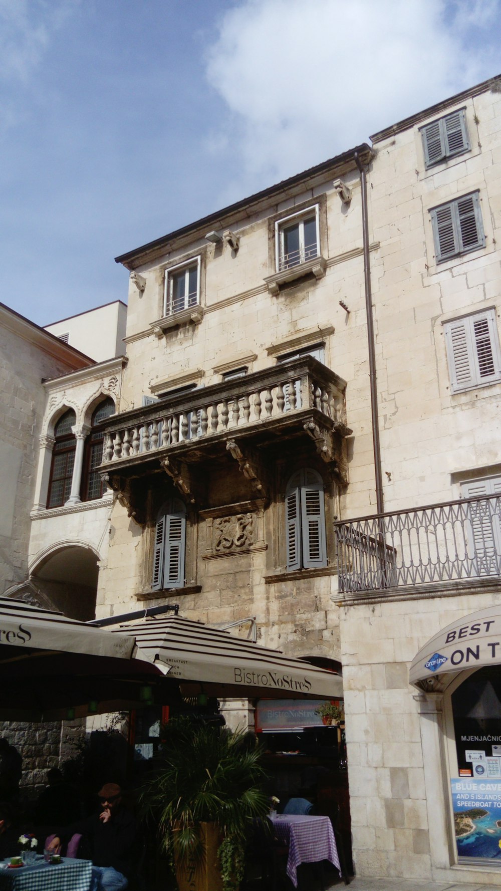 an old building with a balcony and balconies