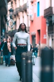 A woman walking confidently down a busy street.