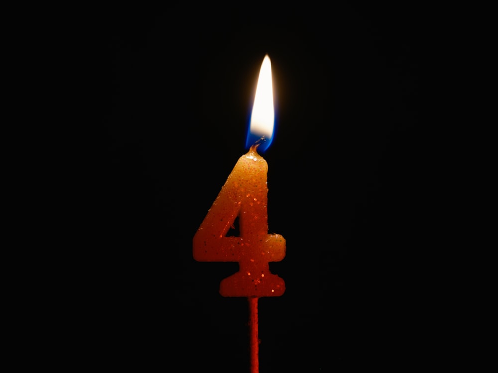 a candle with a candle number four on it