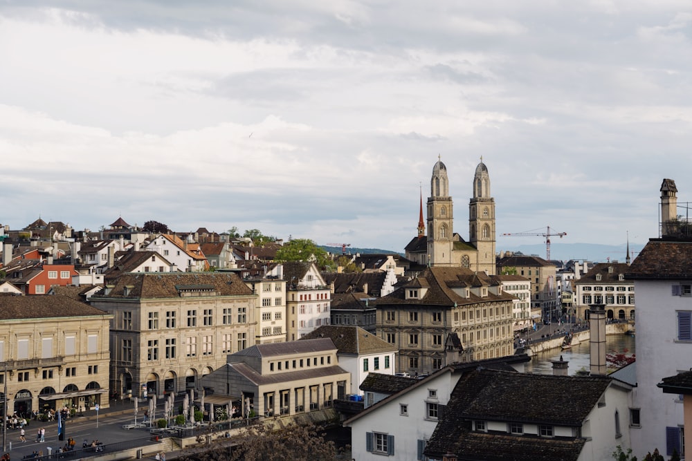 a view of a city with buildings and a clock tower