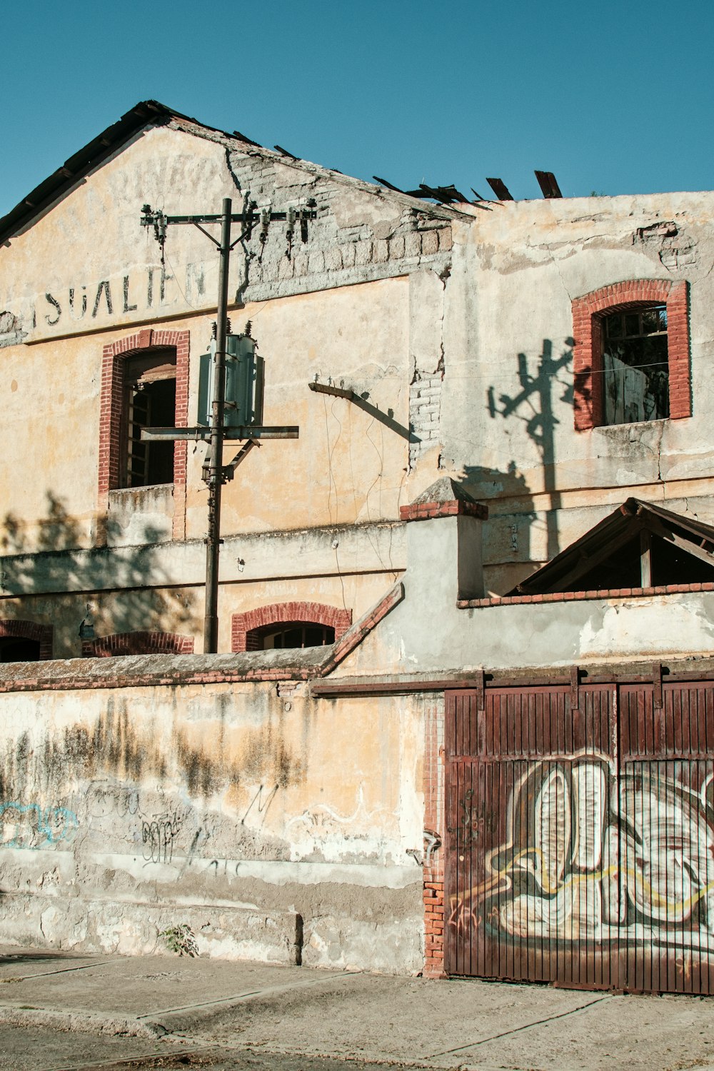 an old building with graffiti on the side of it