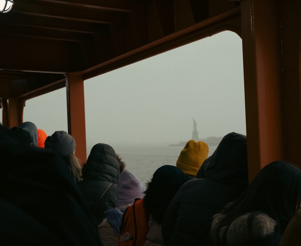 a group of people sitting on top of a boat