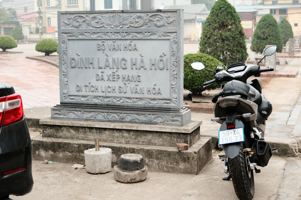 a motorcycle parked in front of a monument