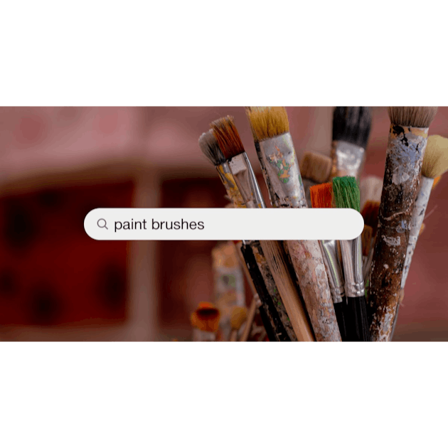 Download premium image of Paintbrushes and art tools in a cup by