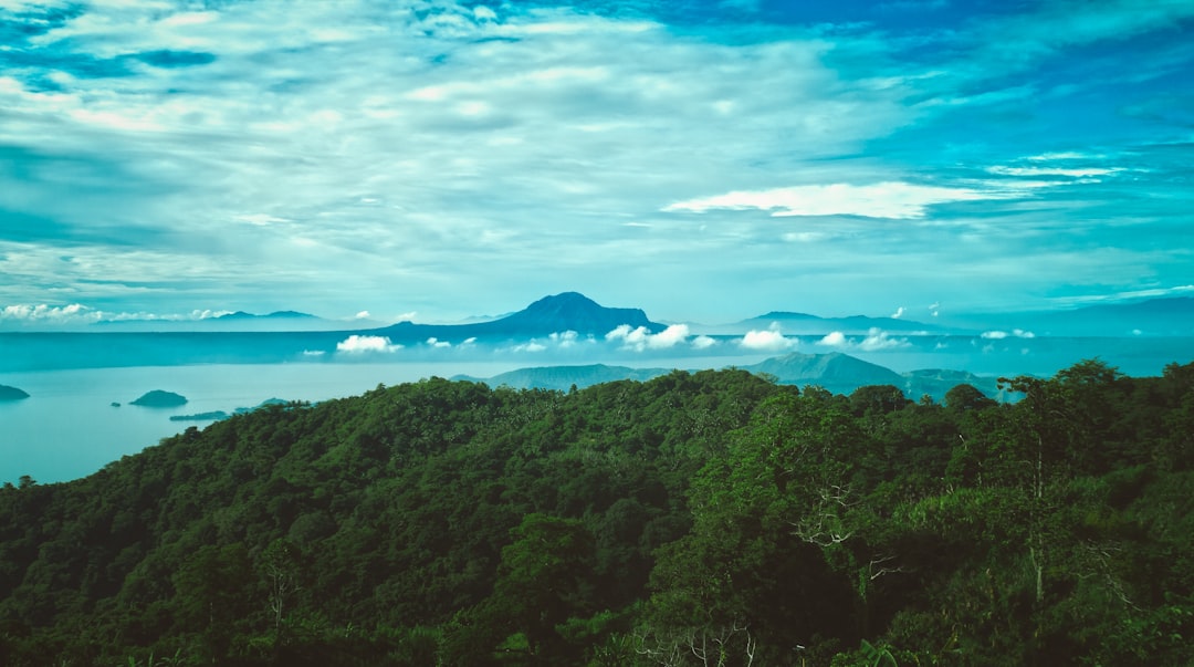 aerial photography of mountains near body of water