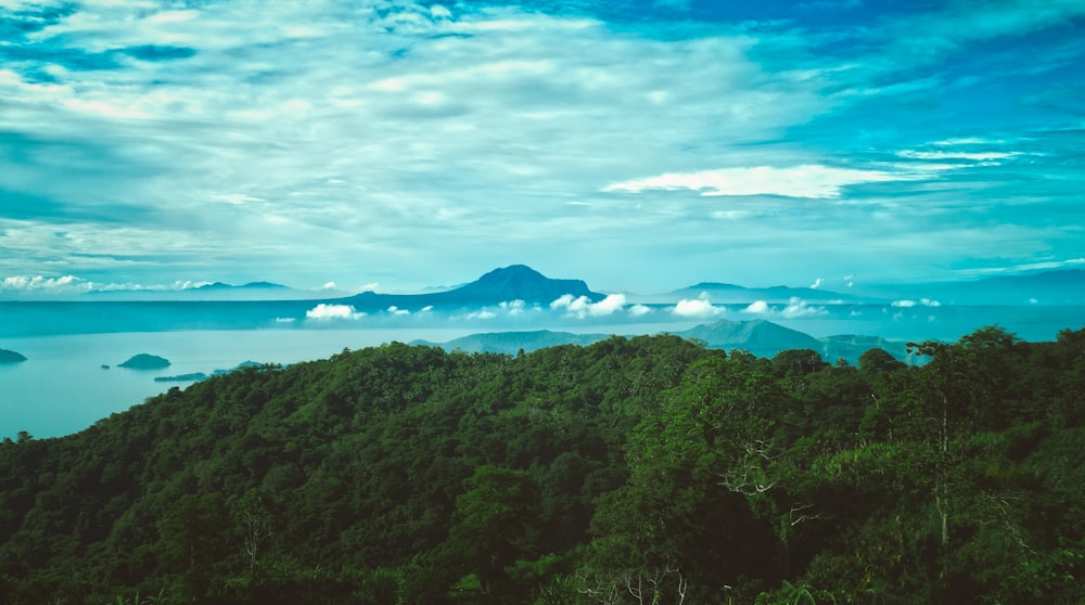 aerial photography of mountains near body of water