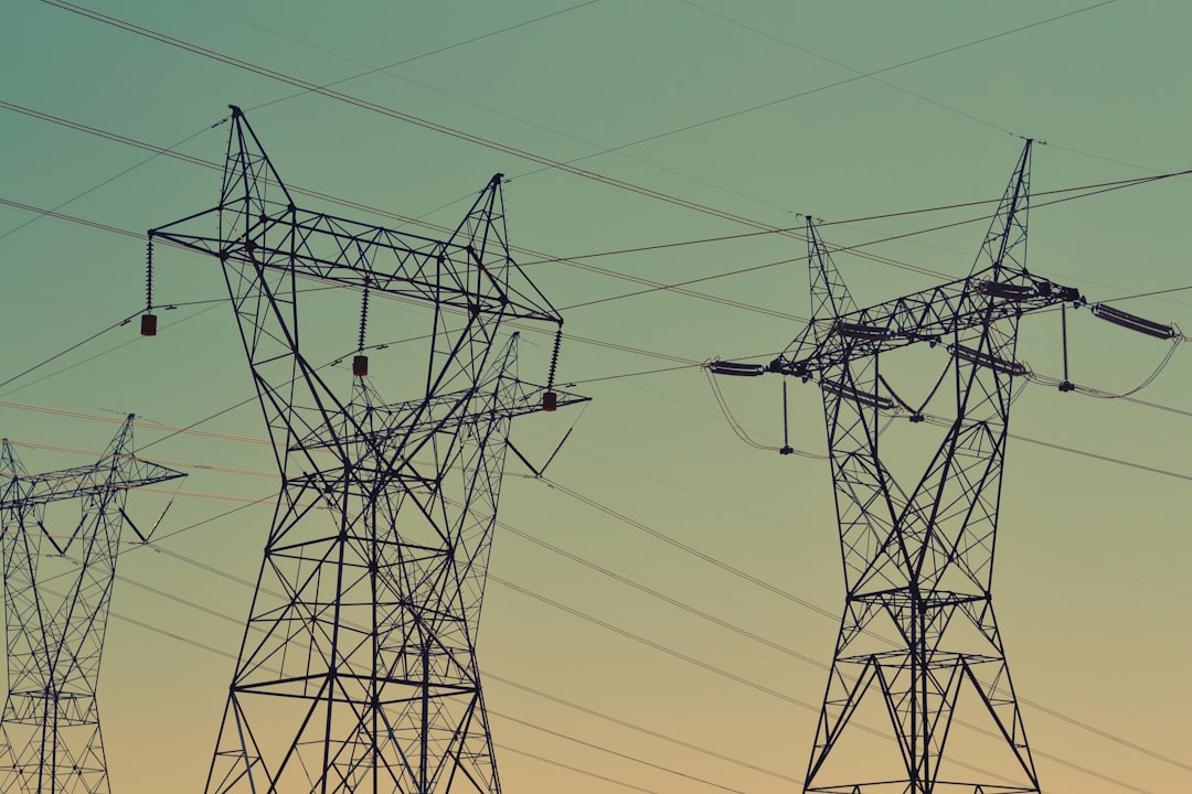 high-voltage transmission towers carrying electricity from grid high-voltage transmission towers carrying electricity from grid