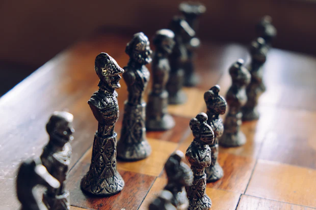 Vintage chess pieces on a wooden board
