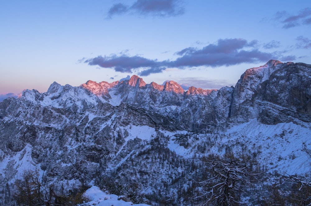 snow filled mountain during golden hour