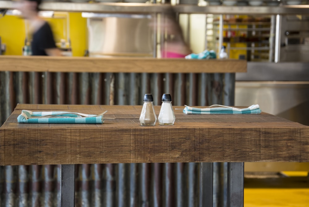 salt and pepper shakers on brown kitchen table