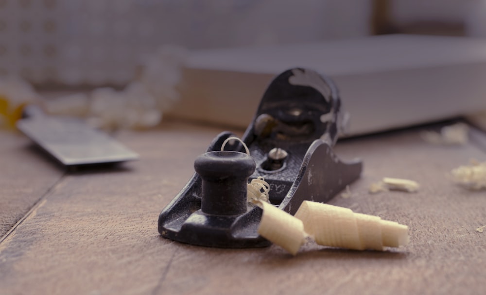 close photography of black jack planer near chisel