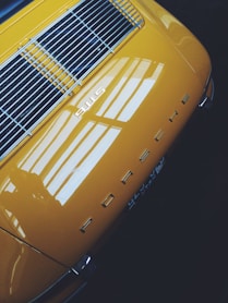 yellow and black Porsche vehicle
