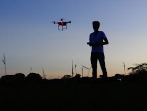 Indian defence drone pilot operating a Canaan Drones UAV during a training exercise at dawn