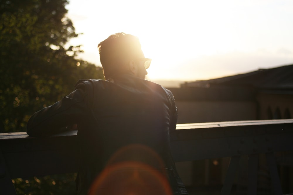 silhouette photography of person at ledge