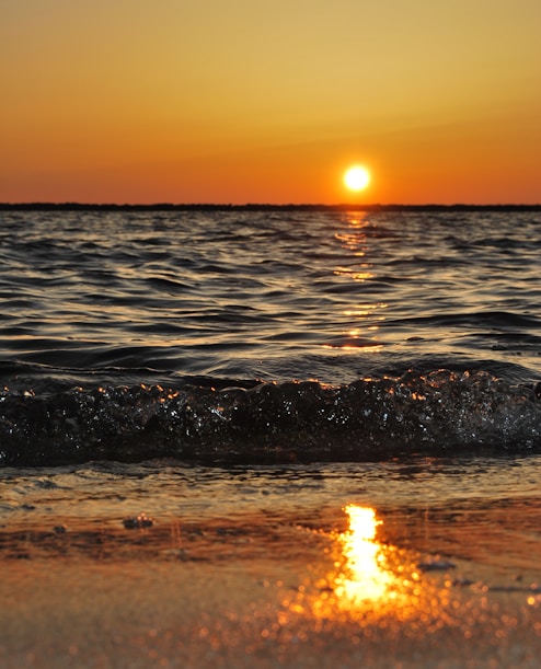 body of water wave photo during golden hour