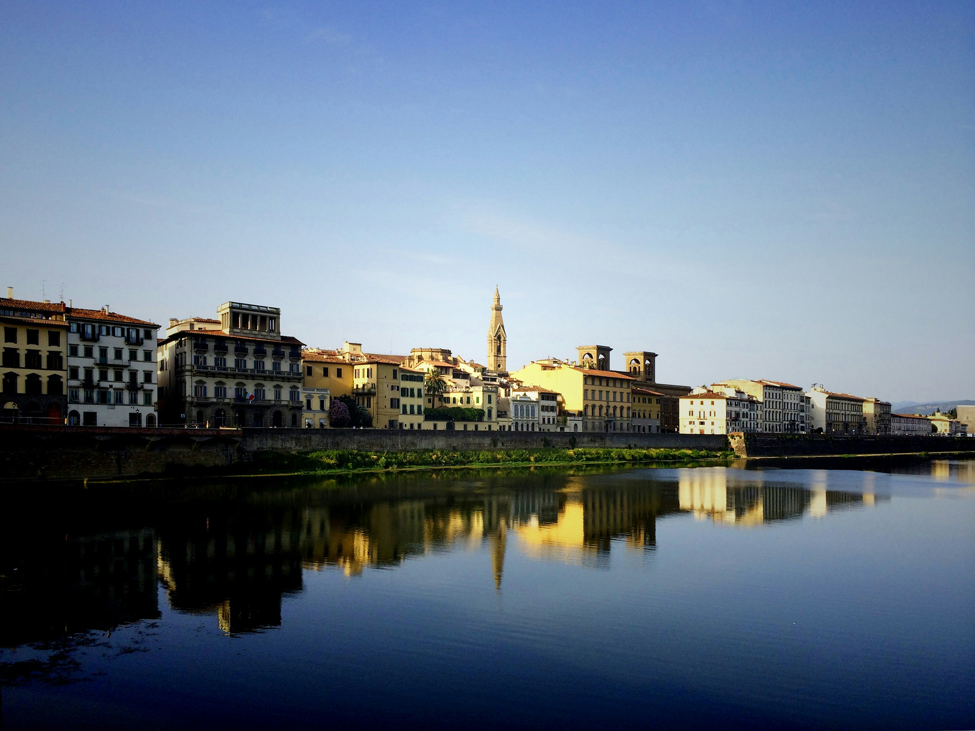 beige buildings near large body of water, 