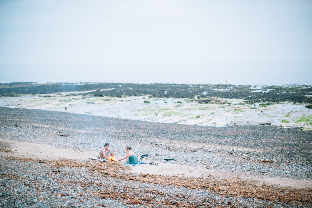 man and woman sitting beside toddler